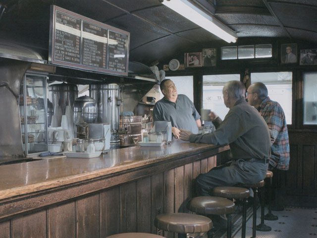 Two customers being served in the interior of Casey's Diner, 36 South Avenue in Natick, MA